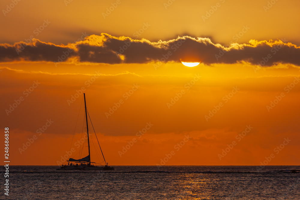 Sea voyage on a sail catamaran at sunset, Mauritius island
