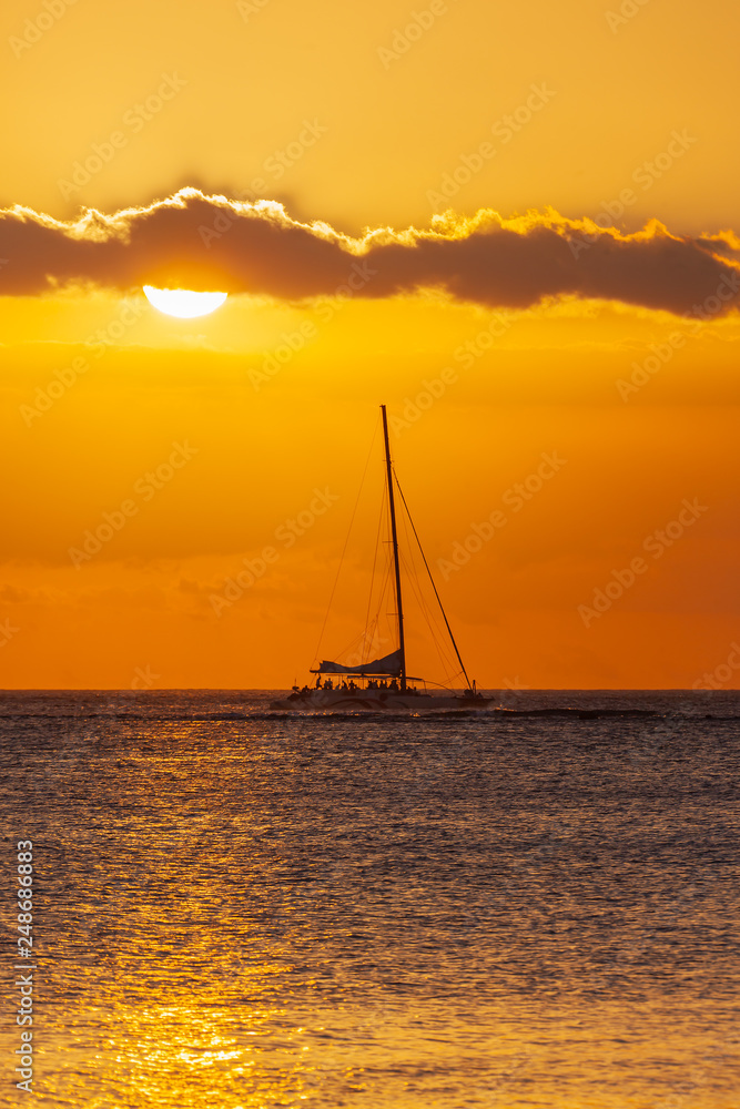 Sea voyage on a sail catamaran at sunset, Mauritius island