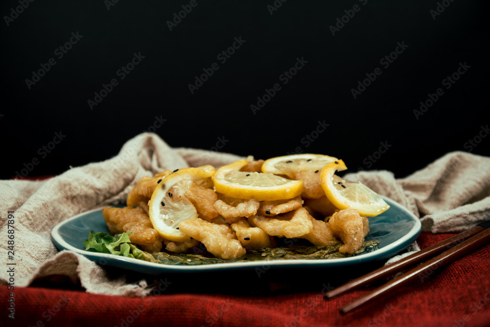 Chinese food fried fish and lemon slices Chinese food fried fish and lemon slices