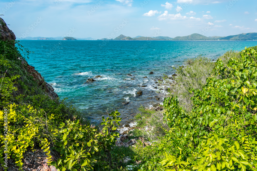 View at beautiful coastline and island in the background. One of the Thailand islands. View at beautiful coastline and island in the background. One of the Thailand islands.