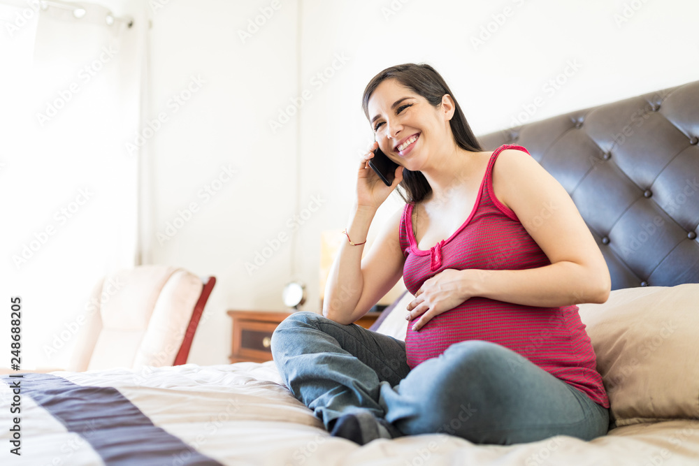 Pregnant Woman Using Smartphone On Bed Pregnant Woman Using Smartphone On Bed