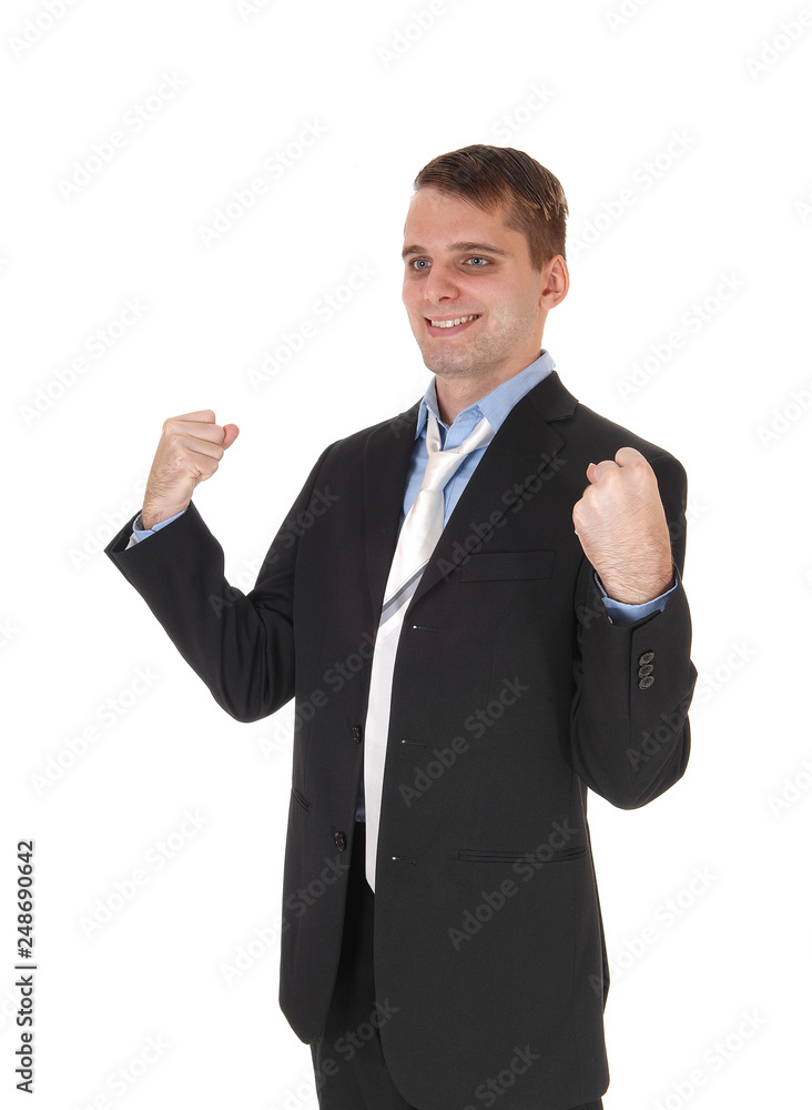 Happy business man standing with fists lifted up Happy business man standing with fists lifted up