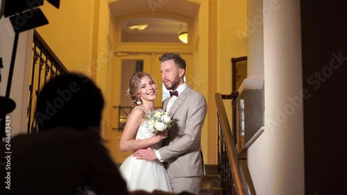 backstage wedding photography - professional photographers take pictures of newlyweds in a chic room