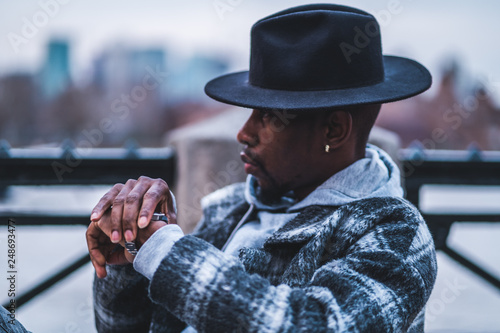 Young fashionable man posing for stylish urban photo shoot 