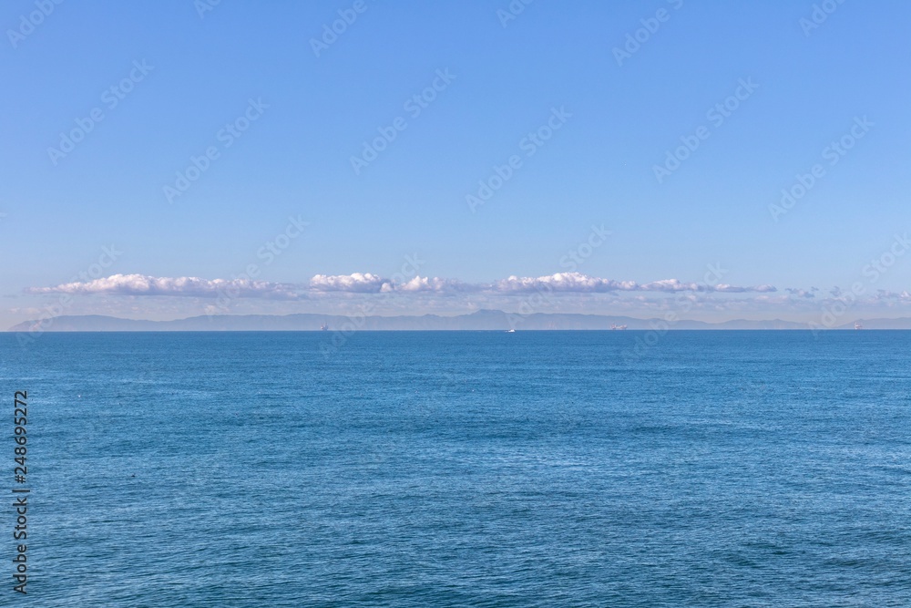 open ocean with island in the background
