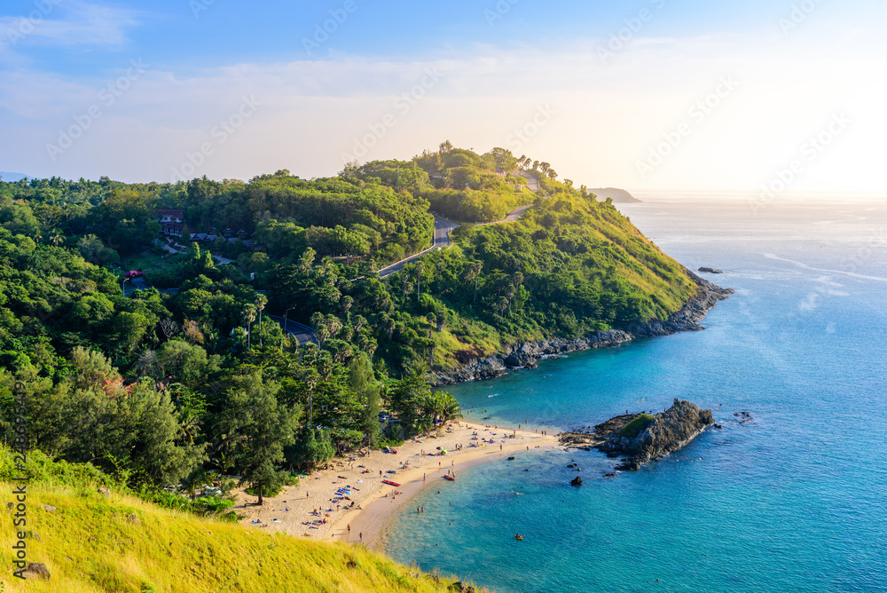 Sunset over Promthep Cape and Yanui beach. Tropical coast with paradise beaches on Phuket, Thailand. Sunset over Promthep Cape and Yanui beach. Tropical coast with paradise beaches on Phuket, Thailand.