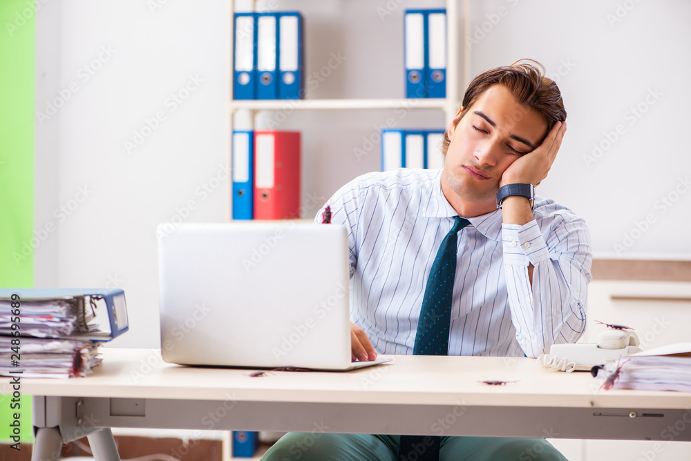 Businessman disgusted with cockroaches in the office Businessman disgusted with cockroaches in the office