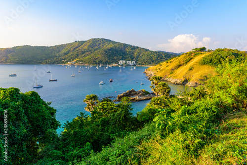 Tropical bay at Naiharn and Ao Sane beach with boats at windmill viewpoint, Paradise destination Phuket, Thailand