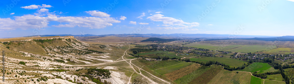 Obraz premium top view from White rock or Aq Qaya on a Sunny summer day. Crimea. White limestone with a vertical cliff