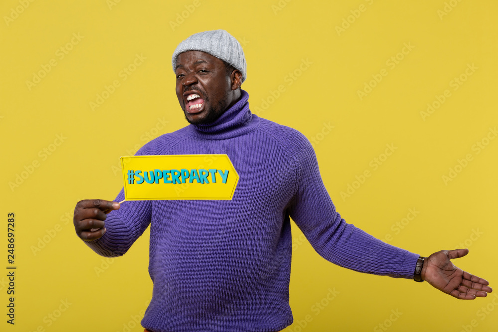 Emotional international man holding nameboard in right hand Emotional international man holding nameboard in right hand