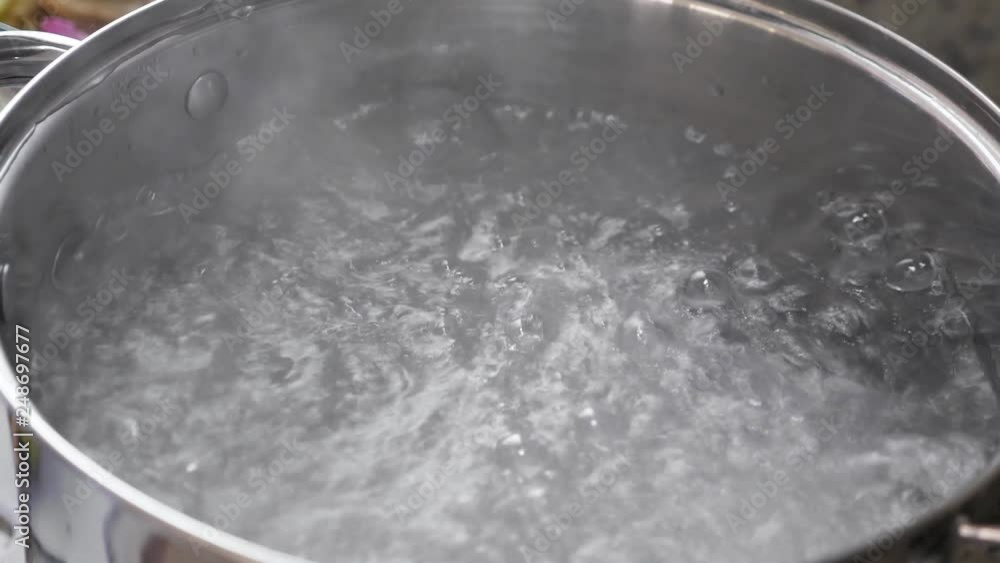 Boiling water in saucepan, closeup. Nobody Boiling water in saucepan, closeup. Nobody