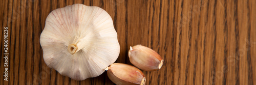 Garlic bulb on the wooden vintage background