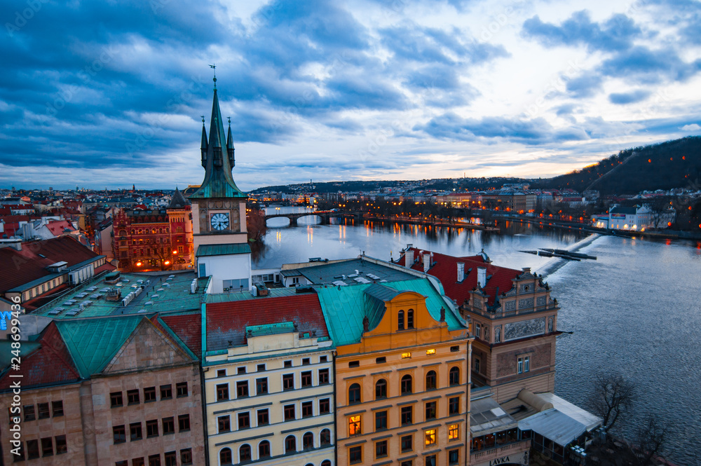 View of the roofs, Vltava and bridges in Prague. Stare Misto. Sunset