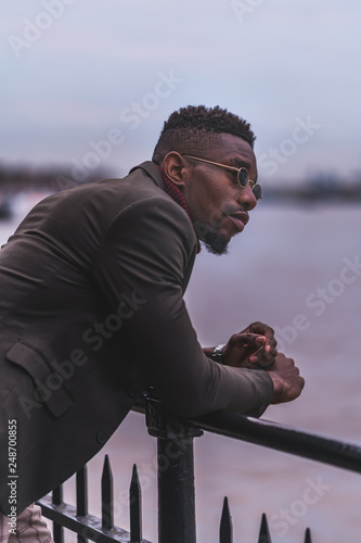 Young fashionable man posing for stylish urban photo shoot 
