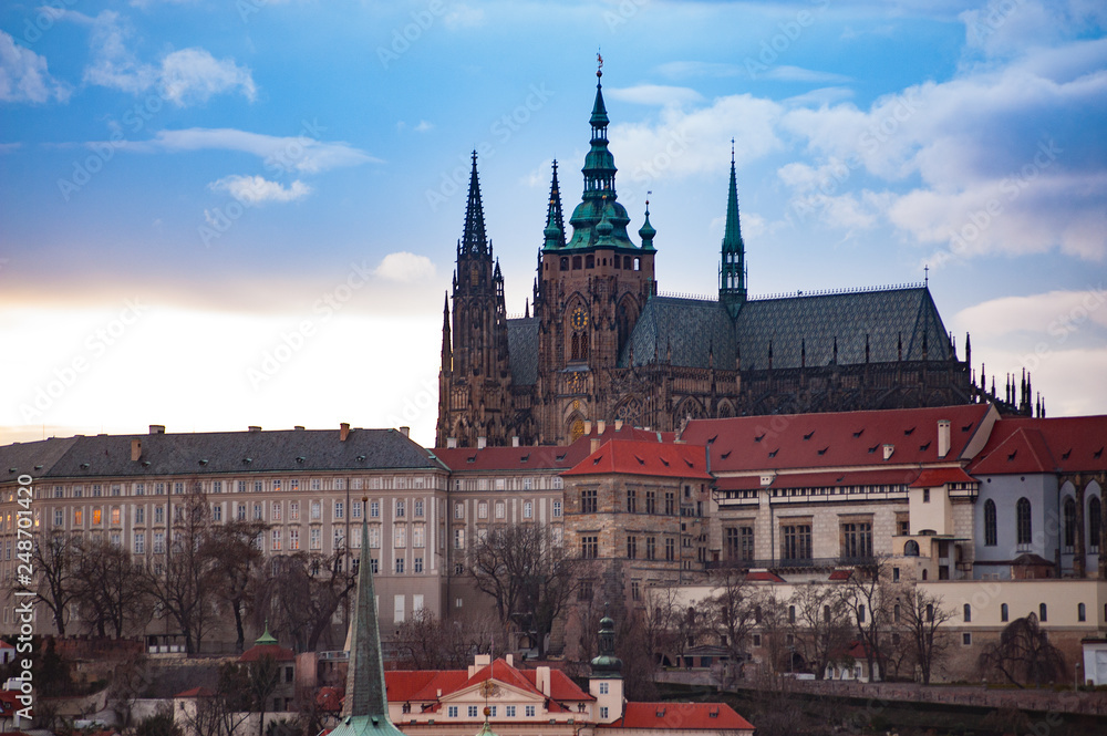View on the red roofs of Mala Strana and St. Vitus Cathedral in Prague.