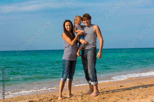 Happy family on the sea beach
