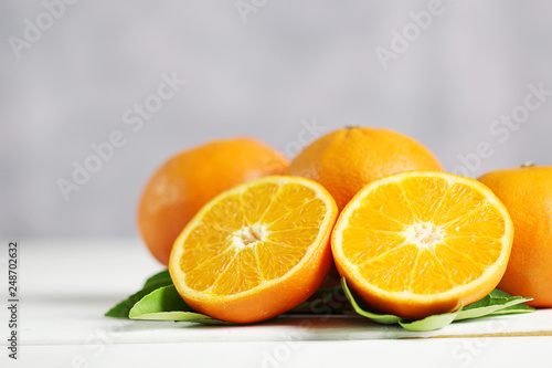 Fresh oranges fruit on white table background.