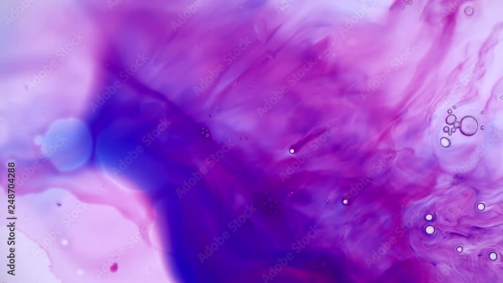 Blue and red ink merging and blending together for beautiful abstract background Blue and red ink merging and blending together for beautiful abstract background