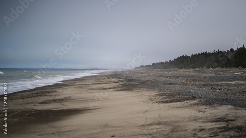great beach on the east coast of New Zealand, New Zealand ocean beach, amazing natura of New Zealand, foggy weather in on the South Island of New Zealand
