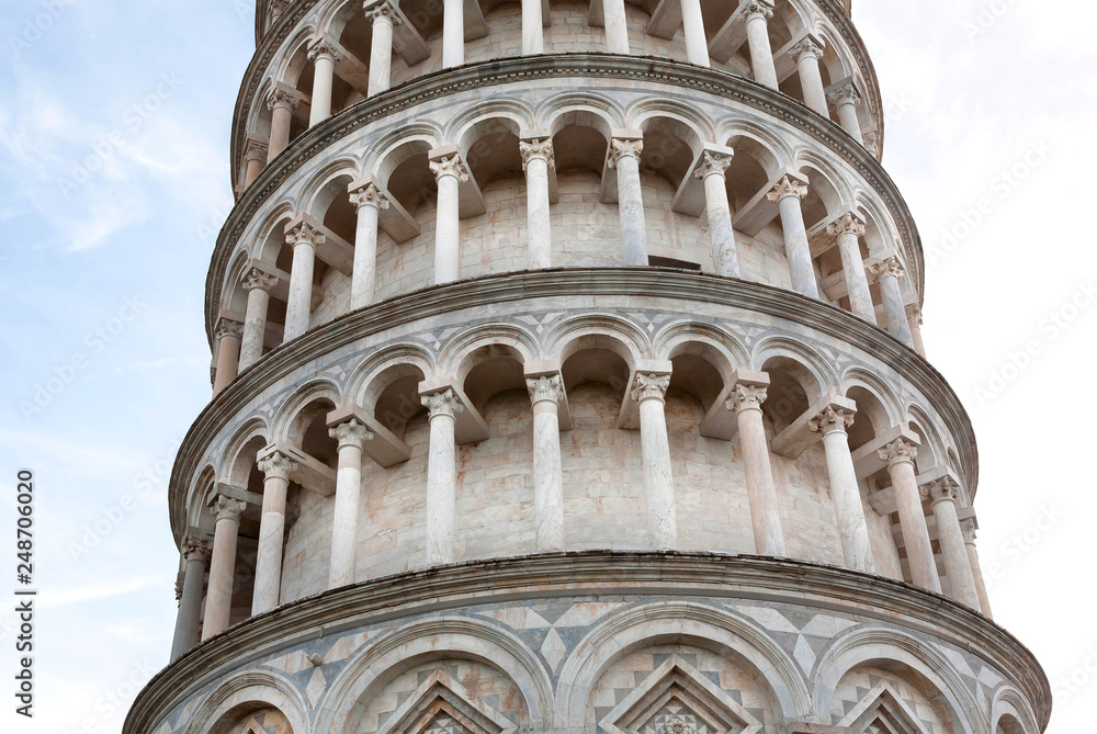 Close-up columns of 14th century Leaning Tower of Pisa, Italy. UNESCO World Heritage Site