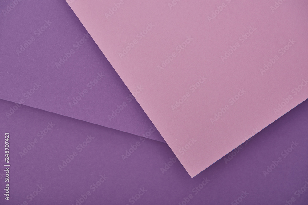 top view of lilac and violet laid out paper sheets with copy space top view of lilac and violet laid out paper sheets with copy space