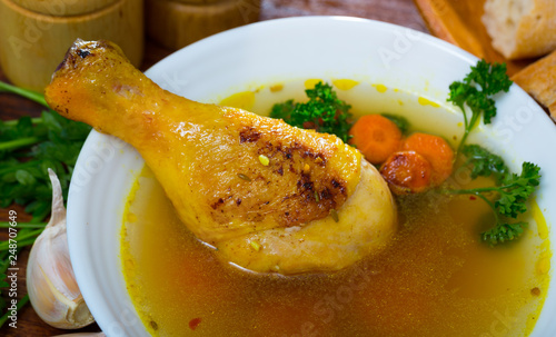 Tasty scottish traditional soup cock-a-leekie with chicken, bacon and leek photo