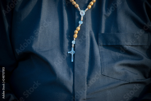 Vatican City, October 03, 2018: A priest with a rosary on his neck during the Opening Mass of the XV Ordinary General Assembly of the Synod of Bishops focusing on young People, the faith and vocationa