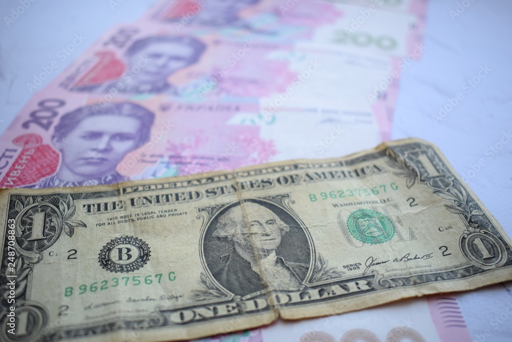 Banknote in one dollar and Ukrainian 200 hryvnia Banknote in one dollar and Ukrainian 200 hryvnia