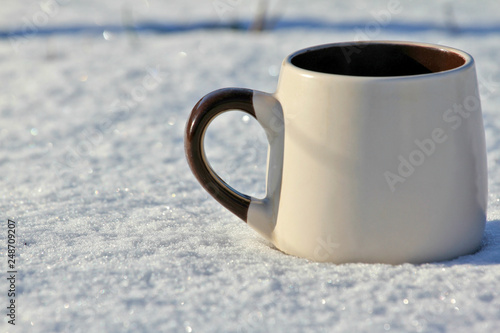 Hot coffee in snow 