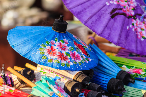Beautiful handmade umbrellas for sale in the local market at northern Thailand. photo