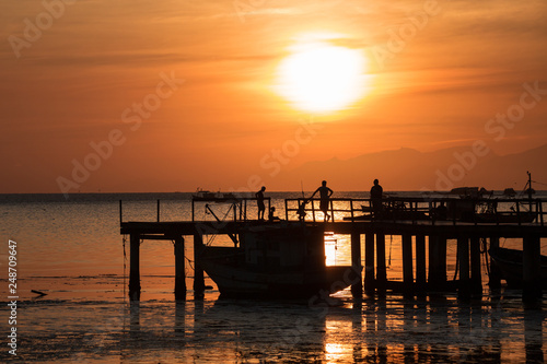 beautiful sunset on the pier of the guaratiba stone  pedra de guaratiba   in the west side of rio de janeiro  brazil