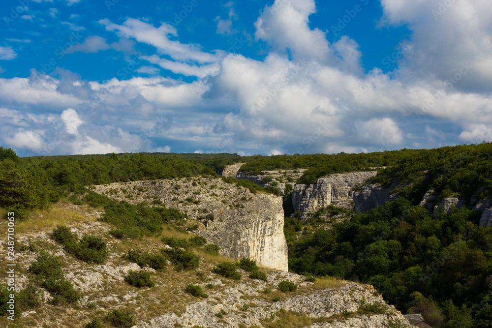 Mountain landscape with blue sky and clouds