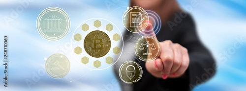 Cuadro en lienzo Woman touching a bitcoin regulation concept