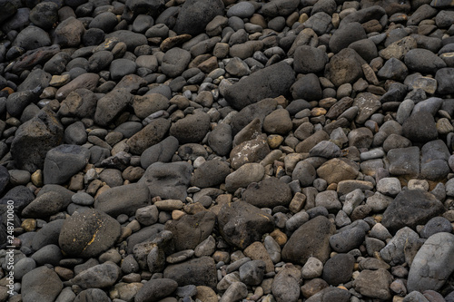 stone texture background with some ocean in the frame, stone background image, rocks at the ocean of New Zealand