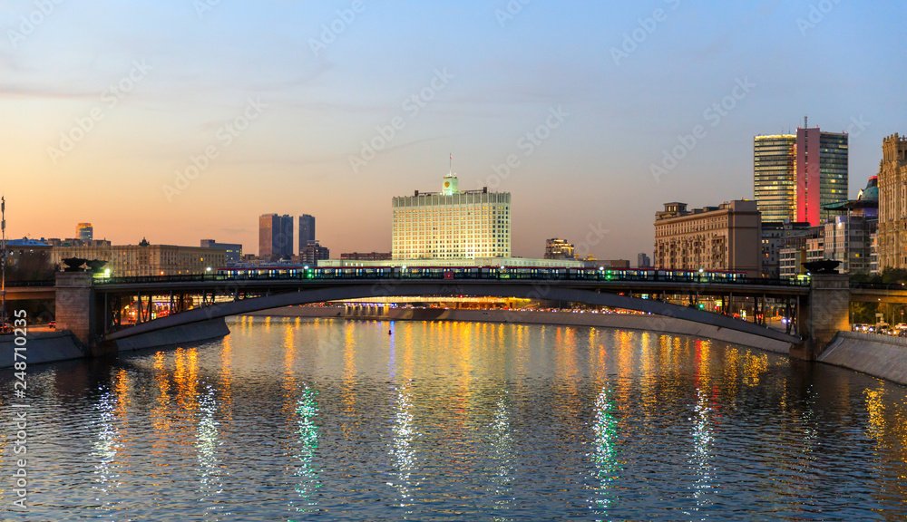 House of the government of the Russian Federation, beautiful Moscow river, night road and water traffic along the river and the embankment.