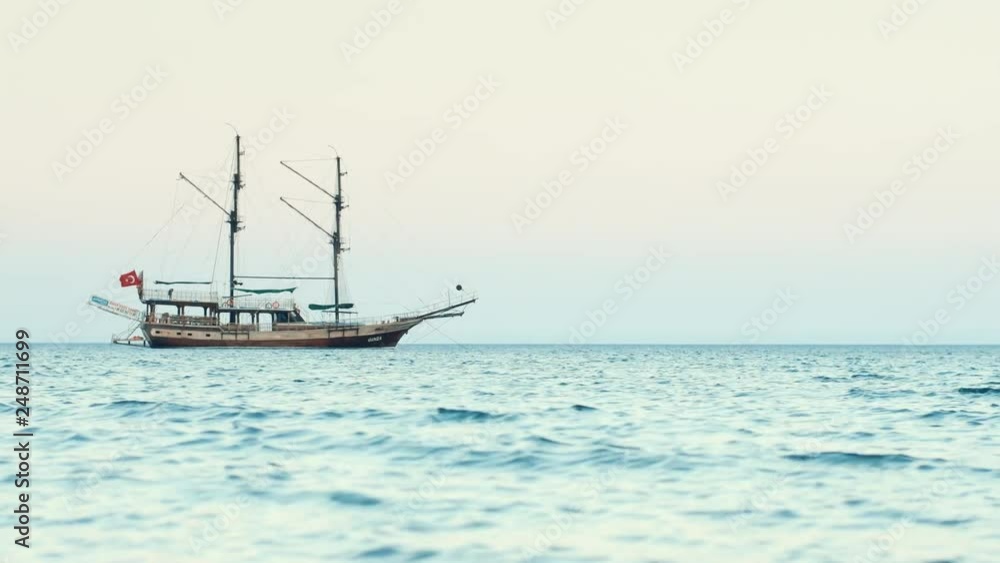 Historical sail ship in sea. Beautiful frigate drifting in ocean. Old tall ship Historical sail ship in sea. Beautiful frigate drifting in ocean. Old tall ship