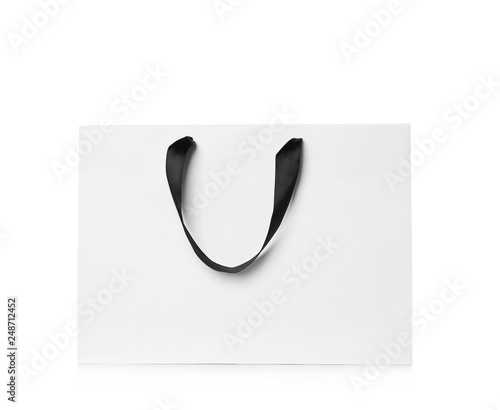 Paper shopping bag isolated on white. Mock up for design photo