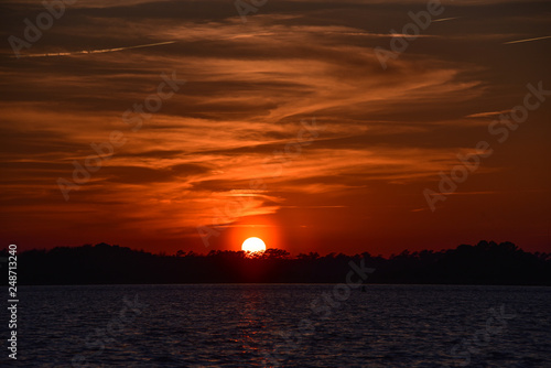 Orange ball of sun at sunset