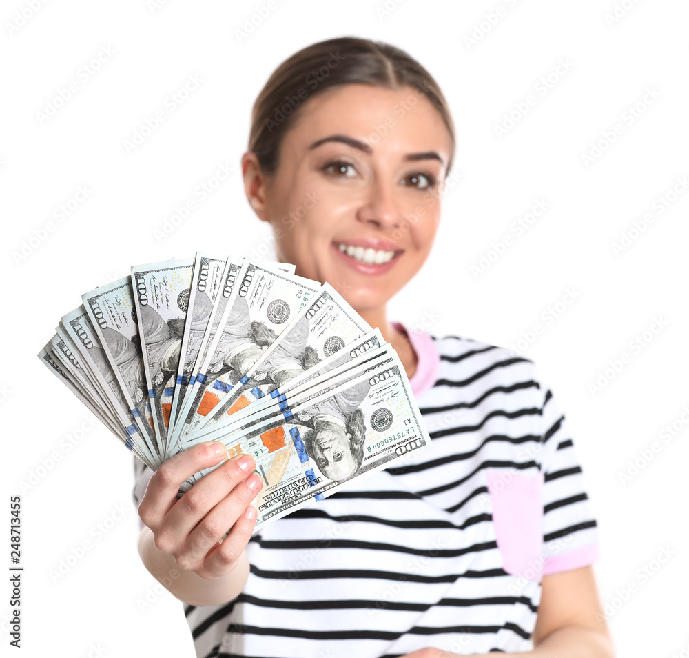 Portrait of young woman holding money banknotes on white background Portrait of young woman holding money banknotes on white background