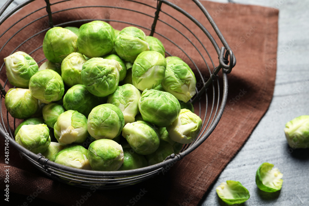 Basket with fresh Brussels sprouts on table, closeup Basket with fresh Brussels sprouts on table, closeup