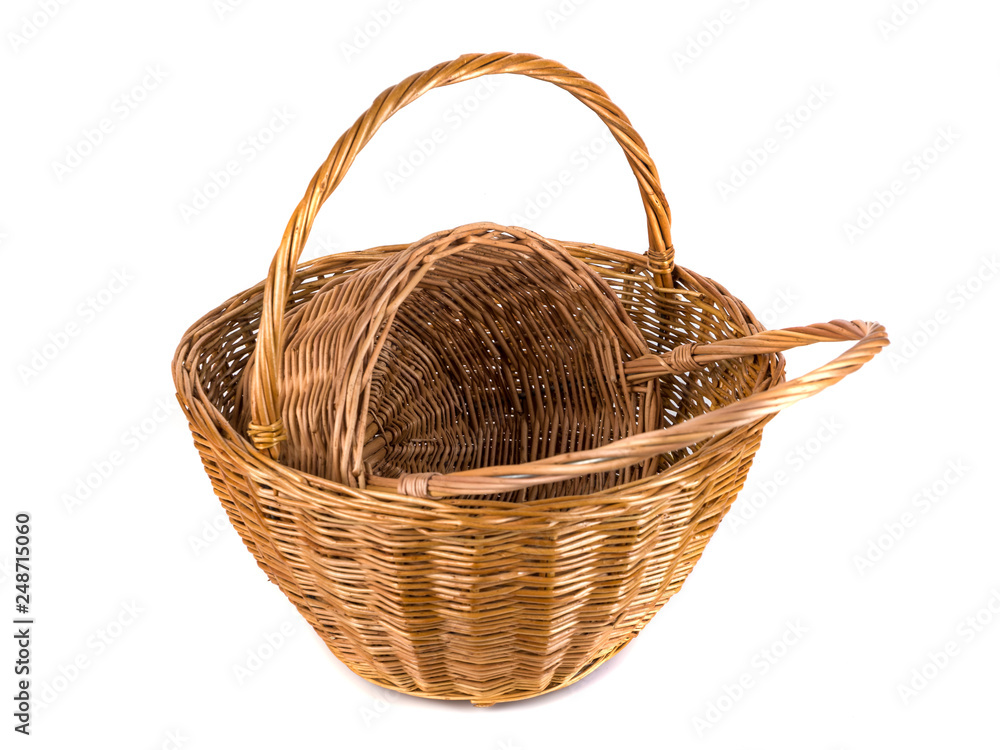 Two empty wicker basket for fruits and vegetables, isolated on white Two empty wicker basket for fruits and vegetables, isolated on white