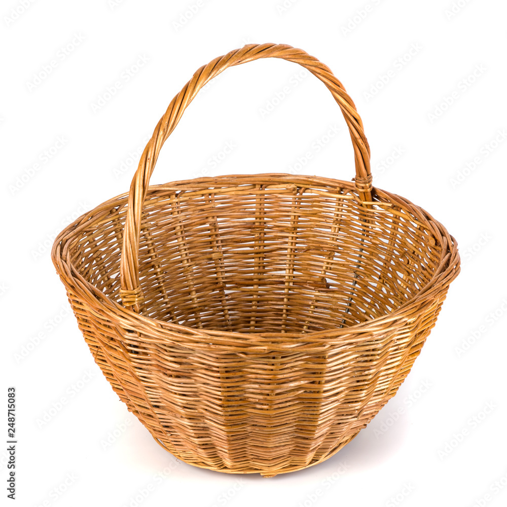 Obraz premium Empty wicker basket for fruits and vegetables, isolated on white