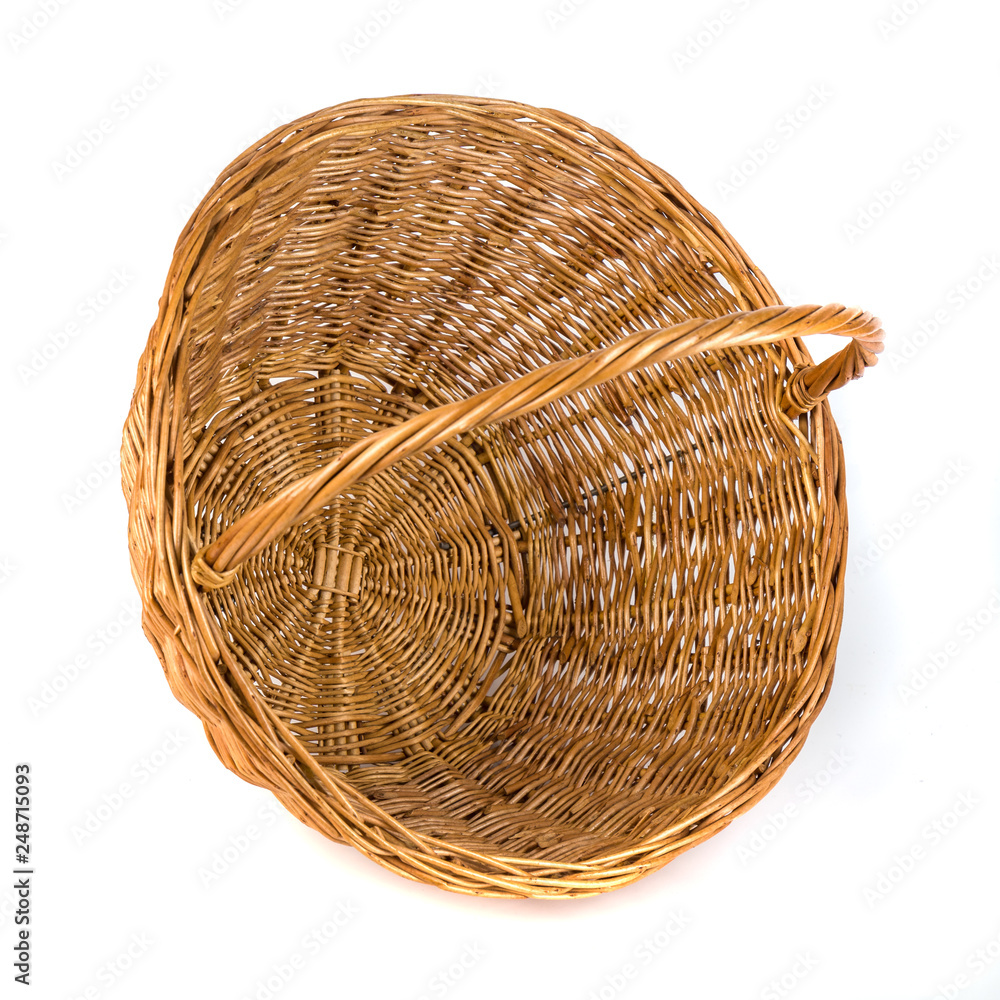 Fototapeta premium Empty wicker basket for fruits and vegetables, isolated on white