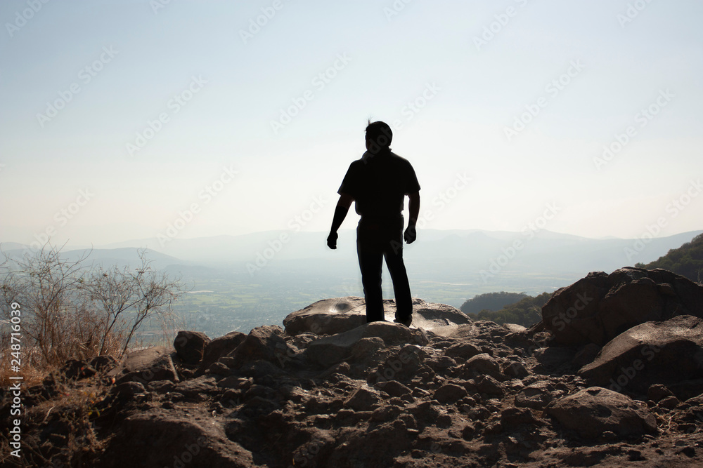 At sunset a man enjoying the horizon on the hill of the speaker in a state of Mexico