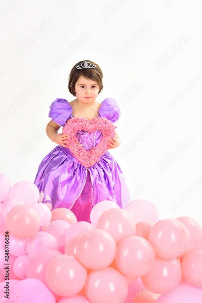 Party balloons. Happy birthday. Valentines day. Little girl princess. Kid fashion. Little miss in dress. Childhood happiness. Childrens day. Small pretty child hold heart. Best Valentines Day