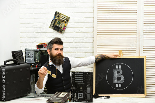 Best provider on the market. Bearded businessman with computer circuits for bitcoin mining. Bearded man bitcoiner. Crypto currency mining hardware. Virtual currency. Bitcoin miner man in server room photo