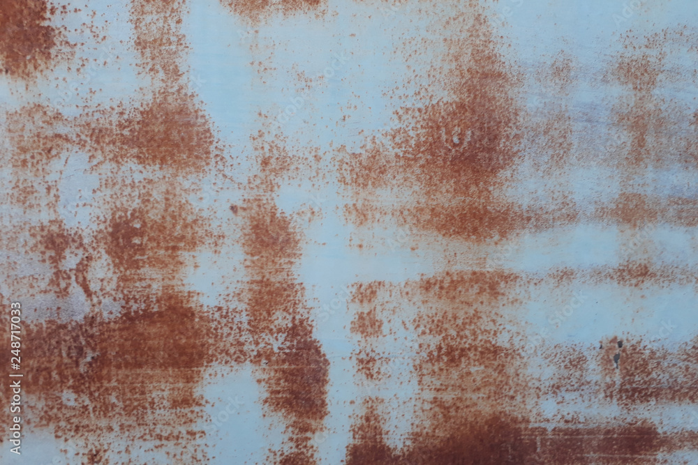 Rusty metal wall,old sheet of iron covered with rust background Rusty metal wall,old sheet of iron covered with rust background