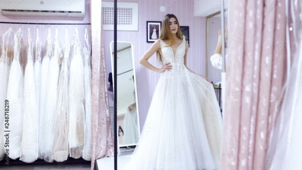 dress fitting in a bridal store dress fitting in a bridal store