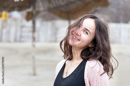 Happy smiling girl, Portrait of beautiful sensitive young girl or woman posing outdoors in casual clothes with smile and adorable eyes