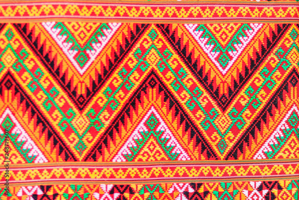 Colorful of native thai style silk and textiles pattern. Beautiful handmade woven fabrics thai silk fabric textured, with different native style patterns.